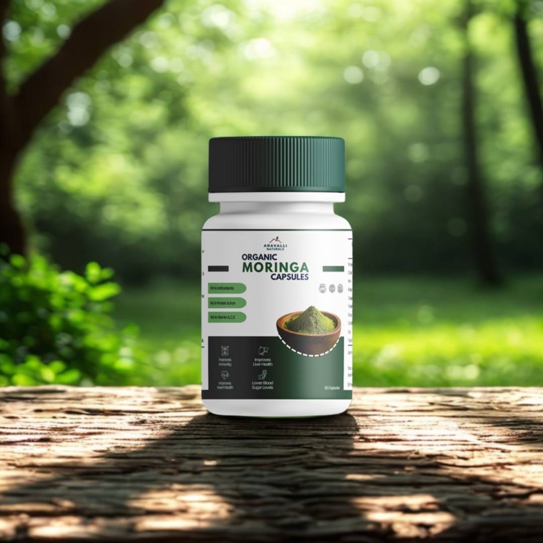 Bottle of Organic Moringa Capsules on a wooden surface with a natural background
