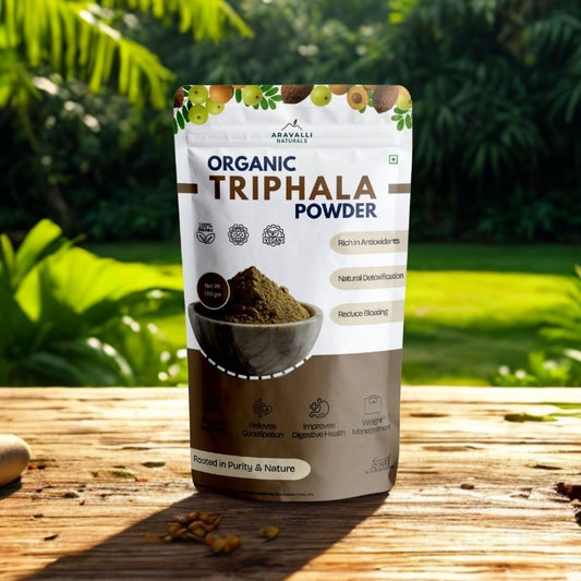 Bag of organic Triphala powder with a natural background